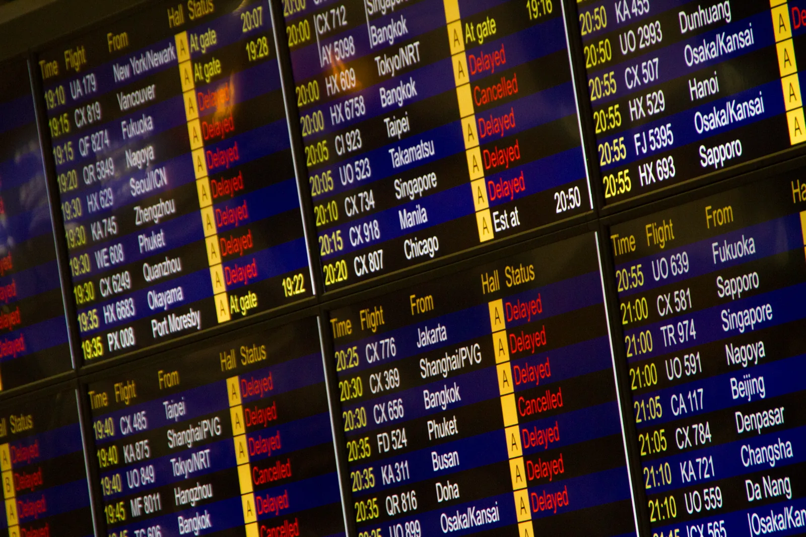 flight cancellation refund policy — passenger checking refund options on a laptop at the airport