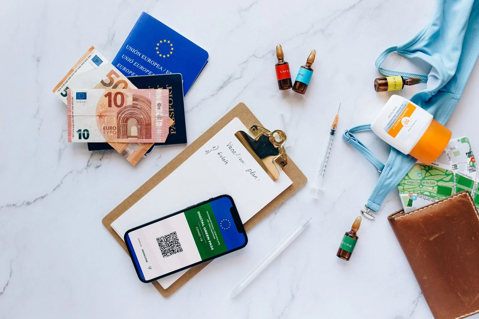 International travel checklist: travel essentials laid out flat for packing